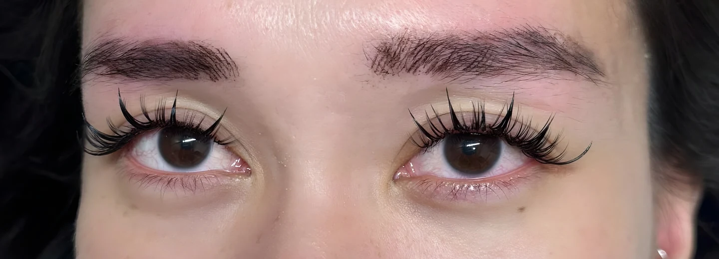 Wispy lash extensions on both eyes, close-up